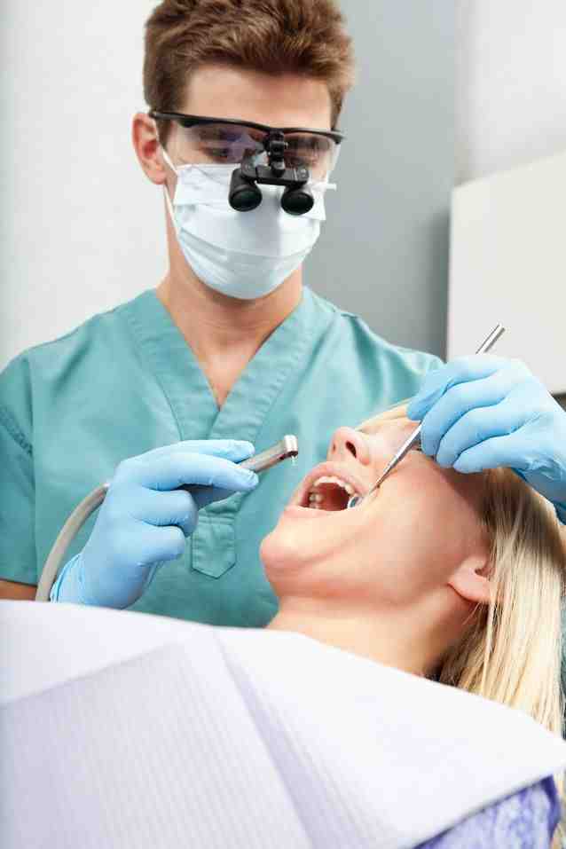Why do dentists poke your gums?